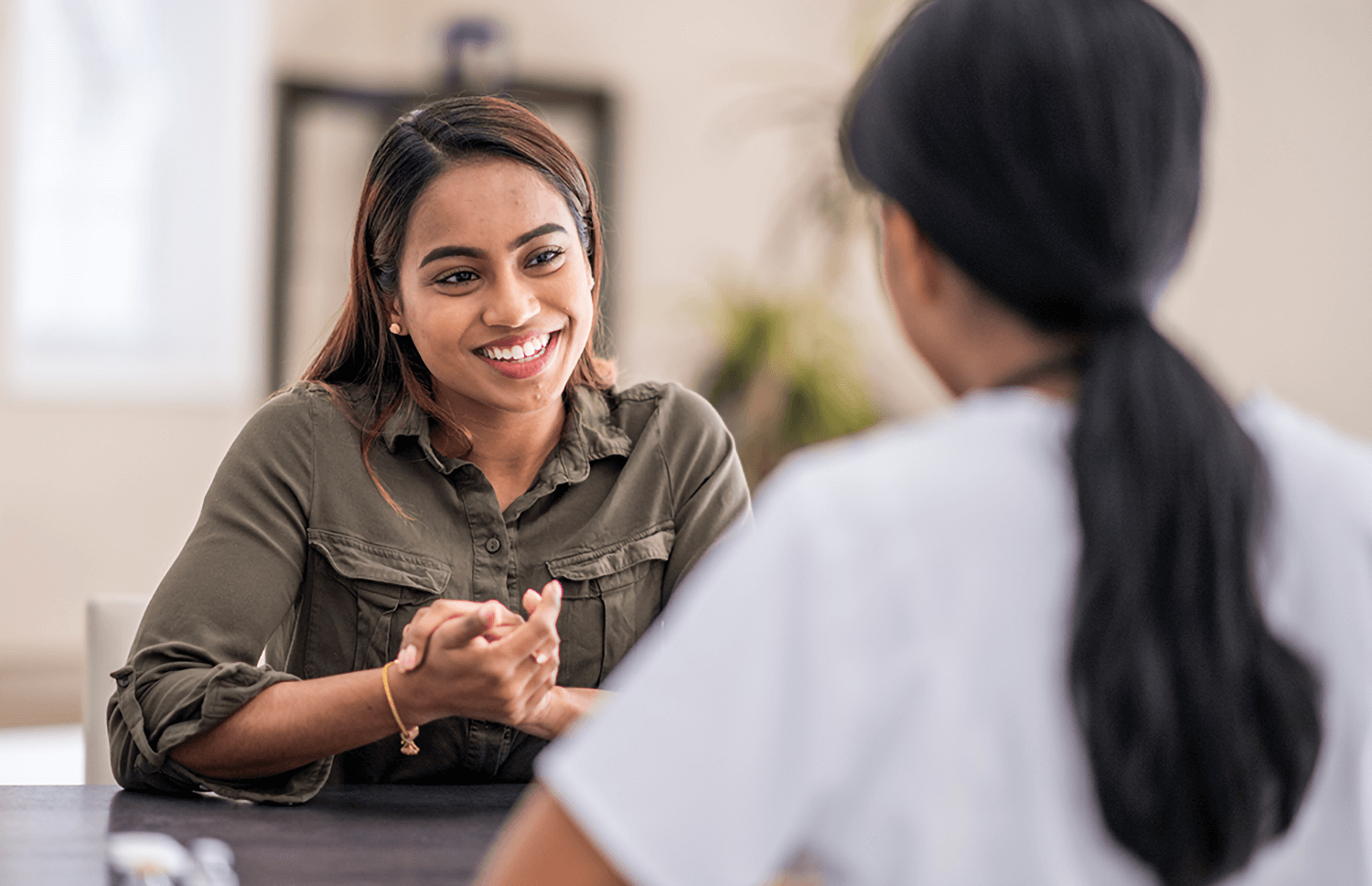 women-smiling-and-talking